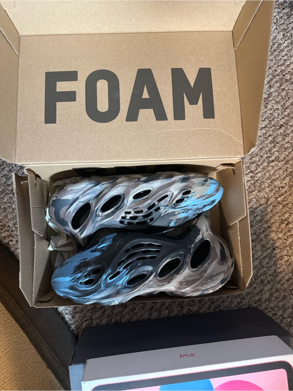 Yeezy Foam Runners in Black, Gray and Light Blue Swirl